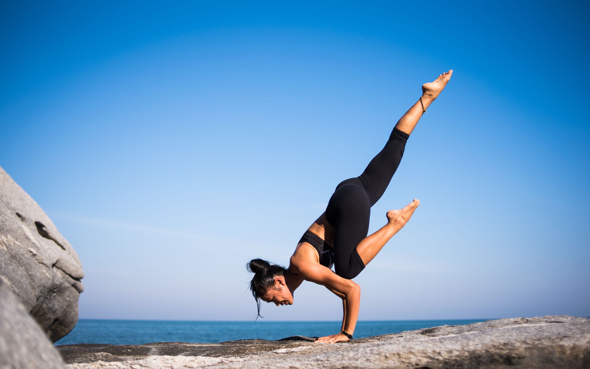 An athlete training outdoors in bright daylight